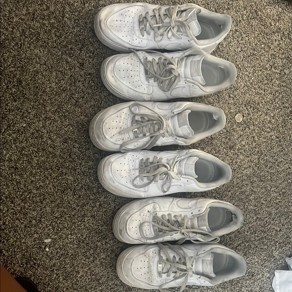 Nike White Athletic Shoes with Light Gray Accents and Low-Top Design